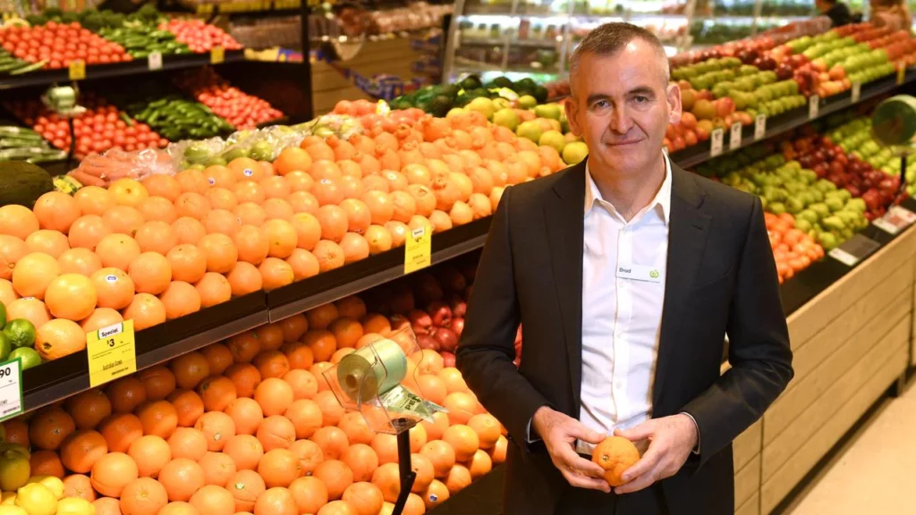 WOOLWORTHS DOWNGRADES PROFIT FORECAST BUT LONG-TERM OUTLOOK UNAFFECTED